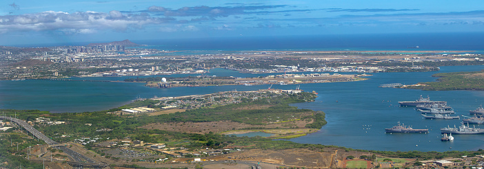 Aerial view of Pearl Harbor and Honolulu, Oahu, Hawaii, USA. From front to back - Pearl City Penninsula, (front right) Middle Loch with remnants of WWII mothball fleet, Ford Island, Joint Base Pearl Harbor-Hickam, Honolulu International Airport with Hickam Field to right, Honolulu, and Diamond Head. Photographed August 9, 2012, by 2018 the mothball fleet was gone.