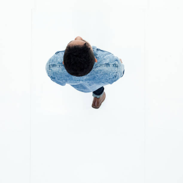 istock Top view of African American man walking 949737404