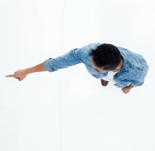 istock Top view of African American man pointing 949739836
