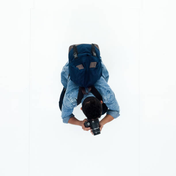 istock Top view of African American man using a camera 949745238
