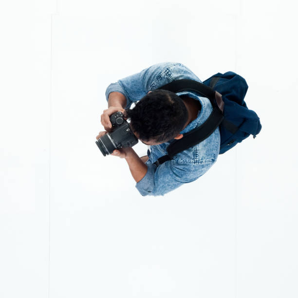 istock Top view of African American man using a camera 949745506