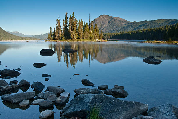 istock Dirtyface Peak and Trees Reflected in a Lake at Sunrise 94974555