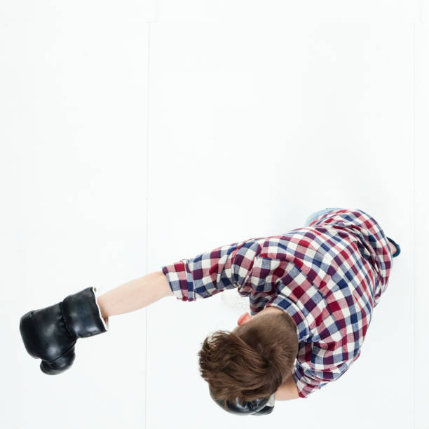 istock Top down view of young man punching with boxing gloves 949745554