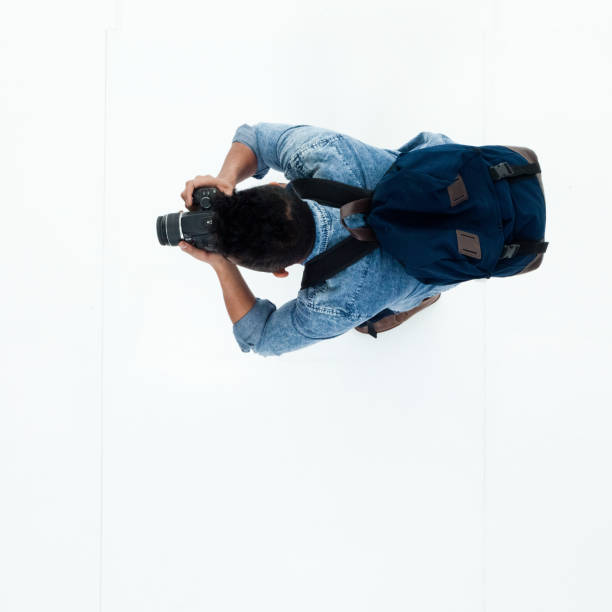 istock Top view of African American man using a camera 949745694