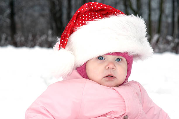 Baby Girl in Red Christmas Hat stock photo