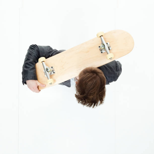 istock Directly above view of young man holding a skateboard 949745834