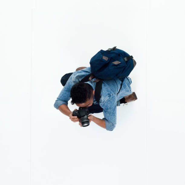 istock Top view of African American man using a camera 949745882