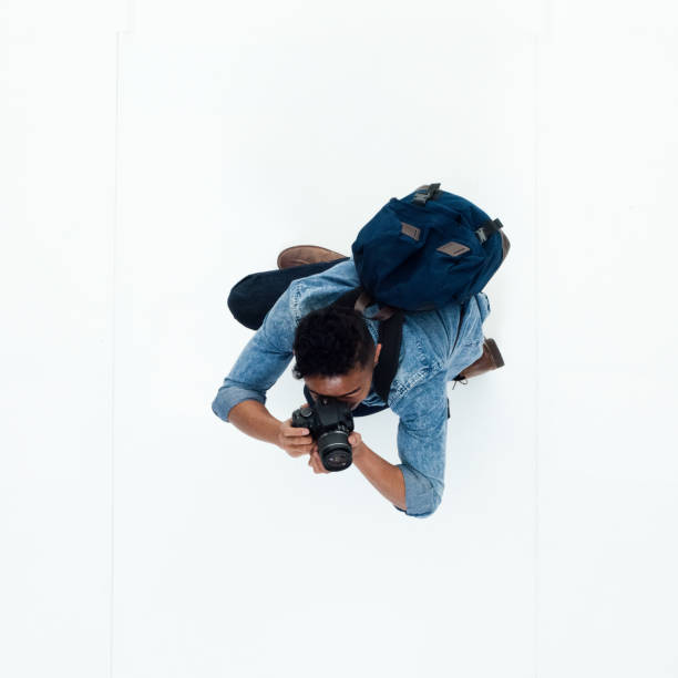 istock Top view of African American man using a camera 949745886