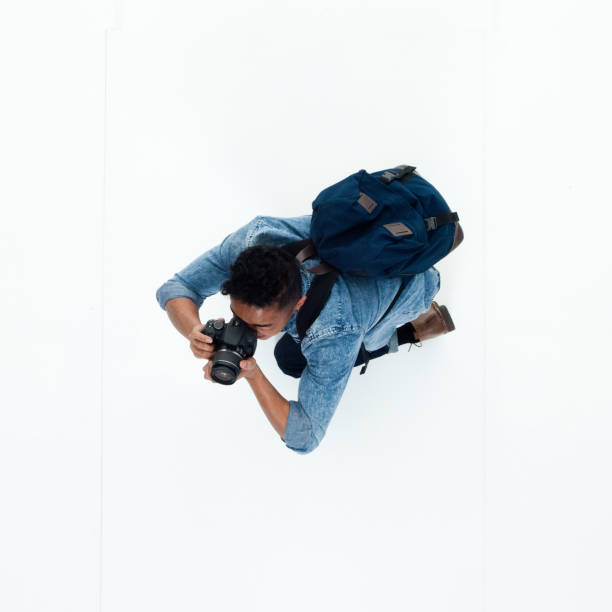 istock Top view of African American man using a camera 949745934