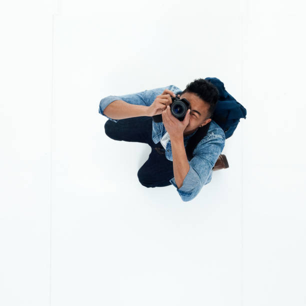 istock Top view of African American man using a camera 949747948