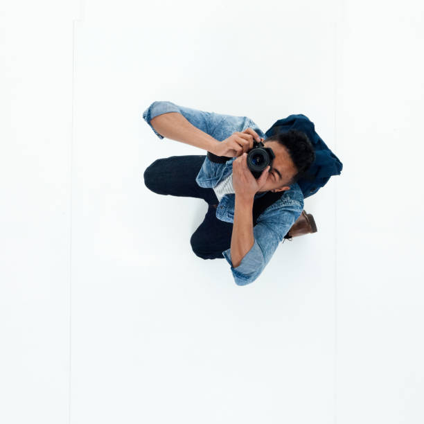 istock Top view of African American man using a camera 949747956
