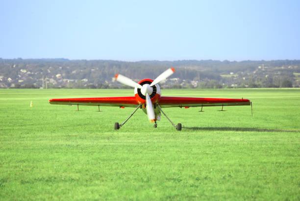 istock Red white airplane on the airfield 949759628