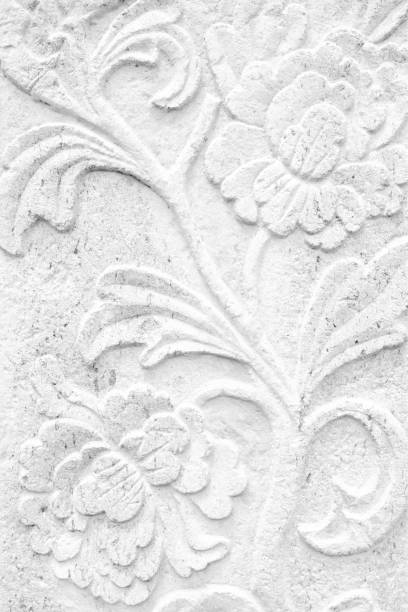 istock Vintage Thai Sculpture on Stone Wall. 949762146