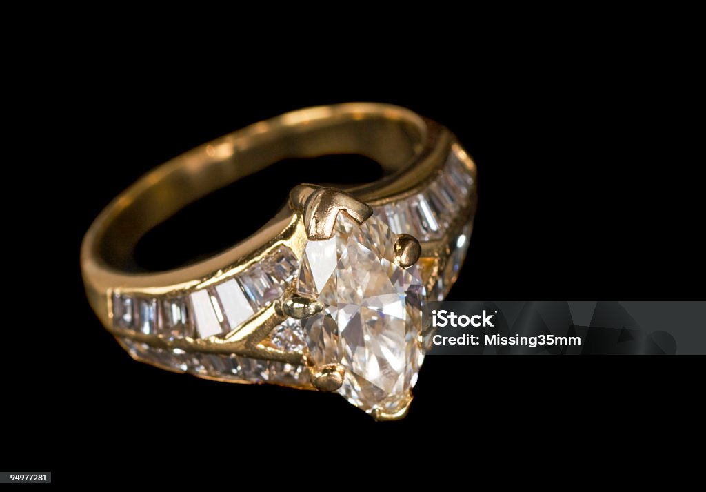 Diamond Ring Isolated on Black A beautiful marquise-cut diamond ring  shot isolated on black. Black Background Stock Photo