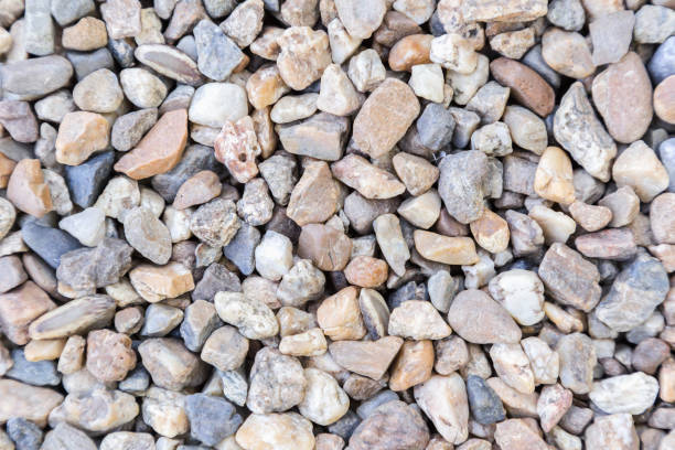 istock Stone pebbles texture or stone pebbles background for interior exterior decoration and industrial construction concept design. Stone pebbles motifs that occurs natural. 949774780