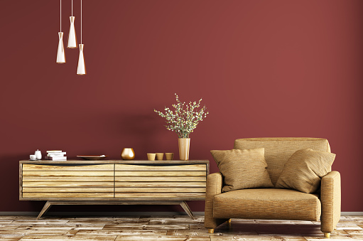Modern interior of living room with wooden dresser and brown armchair over red wall 3d rendering