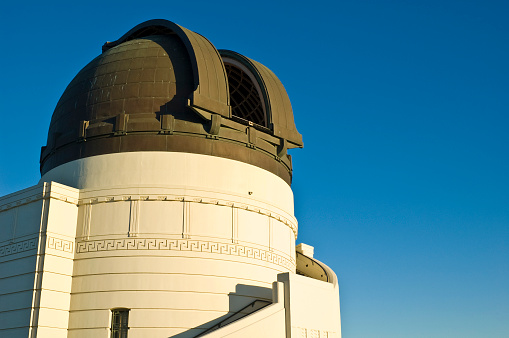 Astronomical observatory under star trails sky at night. High quality photo