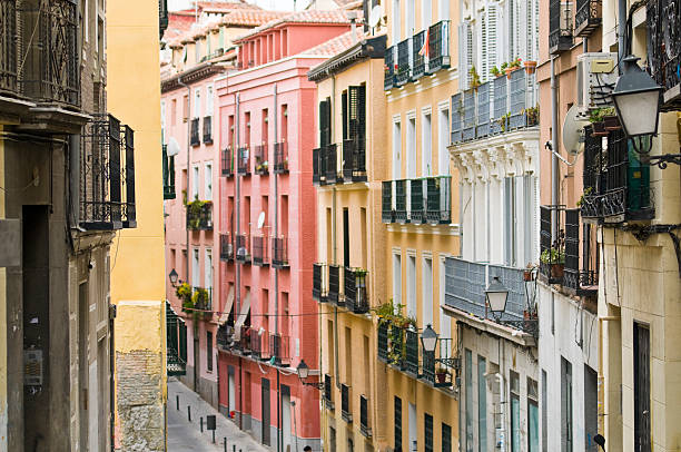 Lavapies Madrid Colorful apartment blocks and iron balconies line a narrow side street in the Lavapies district of Madrid, Spain. Adobe RGB 1998 color profile. madrid stock pictures, royalty-free photos & images