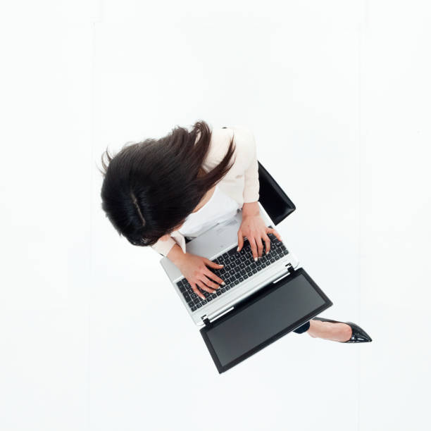 istock Top down view of businesswoman sitting using laptop 949809278