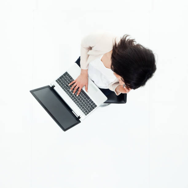istock Top down view of businesswoman sitting using laptop 949809344