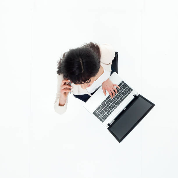 istock Top down view of businesswoman sitting using laptop 949809348