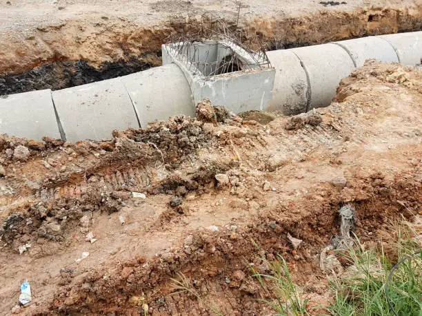Photo of installation concrete drainage before construction road