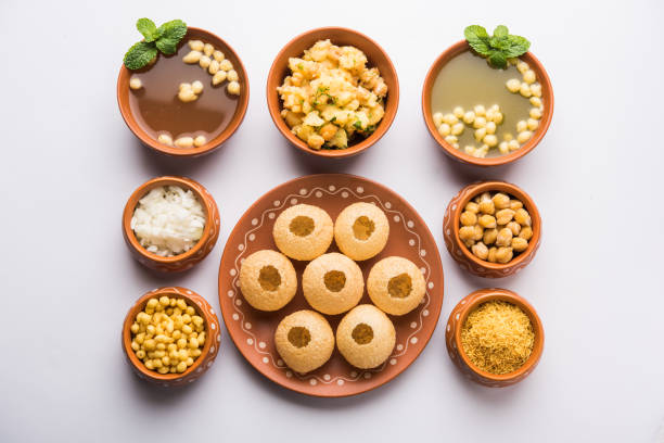 Pani Puri is Indian chat item served in a terracotta bowls and plate Pani Puri is Indian chat item served in a terracotta bowls and plate panipuri stock pictures, royalty-free photos & images
