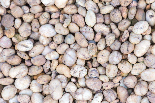 istock Stone pebbles texture or stone pebbles background for interior design business. exterior decoration and industrial construction idea concept design. Stone pebbles motifs that occurs natural. 949831502