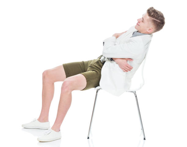 istock Handsome young man resting on chair 949833904