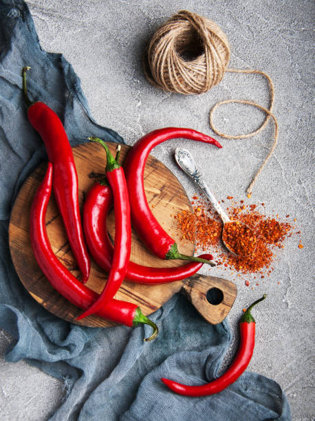 istock Chili peppers on a vintage board 949835904