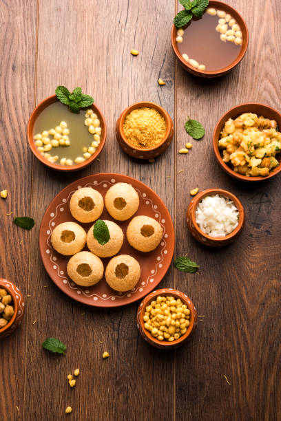 Pani Puri is Indian chat item served in a terracotta bowls and plate Pani Puri is Indian chat item served in a terracotta bowls and plate panipuri stock pictures, royalty-free photos & images