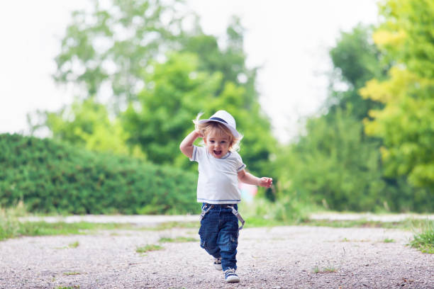 istock Happy little boy running and having fun 949841598