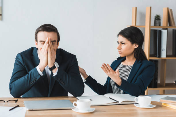 istock Colleagues in business suits arguing about project details in office 949850928