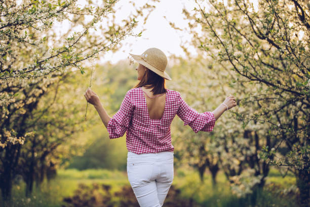 istock Woman in the orchard 949857906