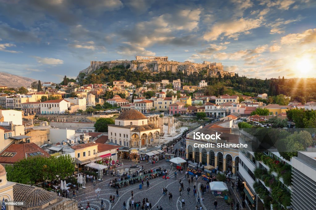 Sunset over the Plaka, the old town of Athens, Greece Sunset over the Plaka, the old town of Athens, Greece, with the Parthenon Temple at the Acropolis Athens - Greece Stock Photo