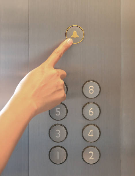 istock Forefinger pressing the alarm bell button in the elevator. 949864494