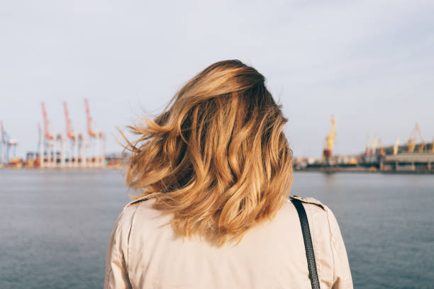 istock Close-up female head with golden curly hairstyle 949870464