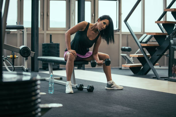 istock Woman workout with dumbbell 949871658