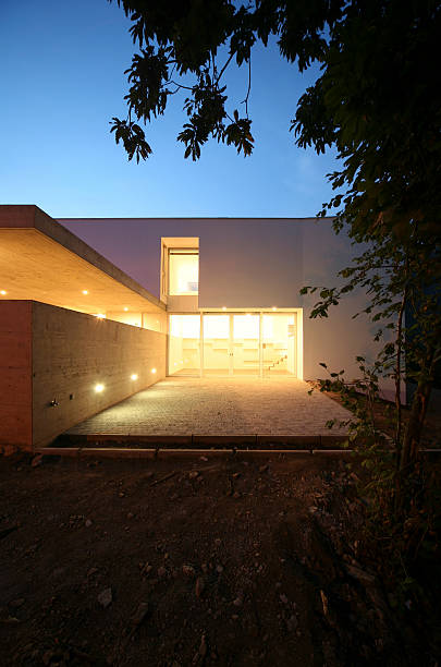 istock Lit up modern styled house at daybreak 94987553