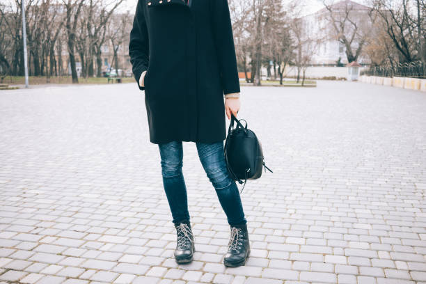 istock Stylish young slender woman walking 949876834