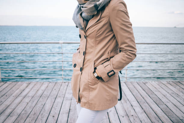 istock Fashionable girl standing on the waterfront 949879620