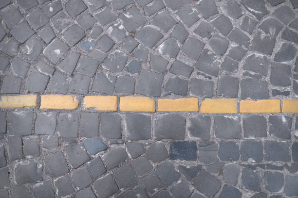 istock Road markings on paving on the street 949880114