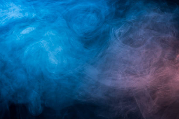 istock Abstract blue and pink smoke on a dark background 949880398
