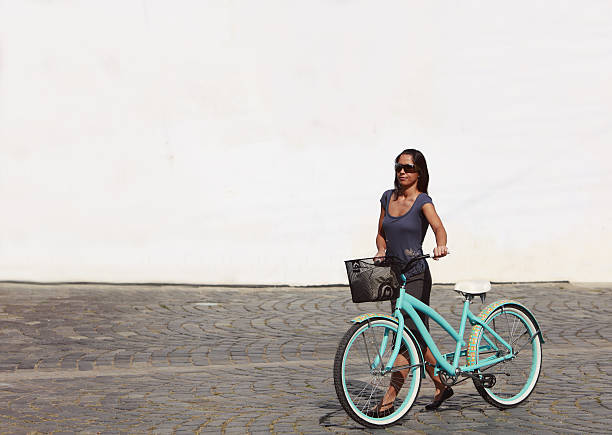 istock Woman With Bicycle In A City 94988420
