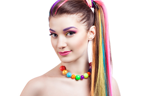 Portrait of a girl with bright make-up and colorful accessories