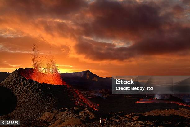 Volcano Erupting At Night Spewing Orange Lava Stock Photo - Download Image Now - Volcano, Erupting, Exploding