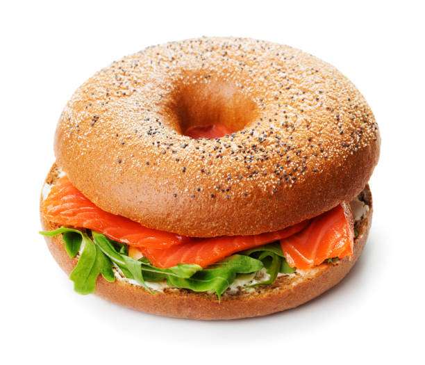 sandwich bagel con salmone isolato - bun sandwich vegetable cream cheese foto e immagini stock