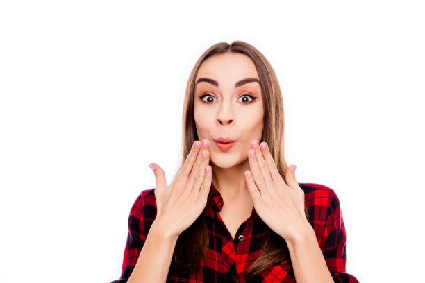 istock Oops! Surprised pretty woman holding hands near face 949903920