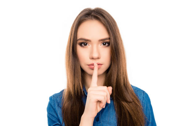 istock Shh! Young pretty woman asking to make silence 949923368