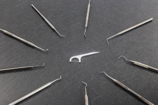istock Oral Device : white dental flosser on gray background 949929388